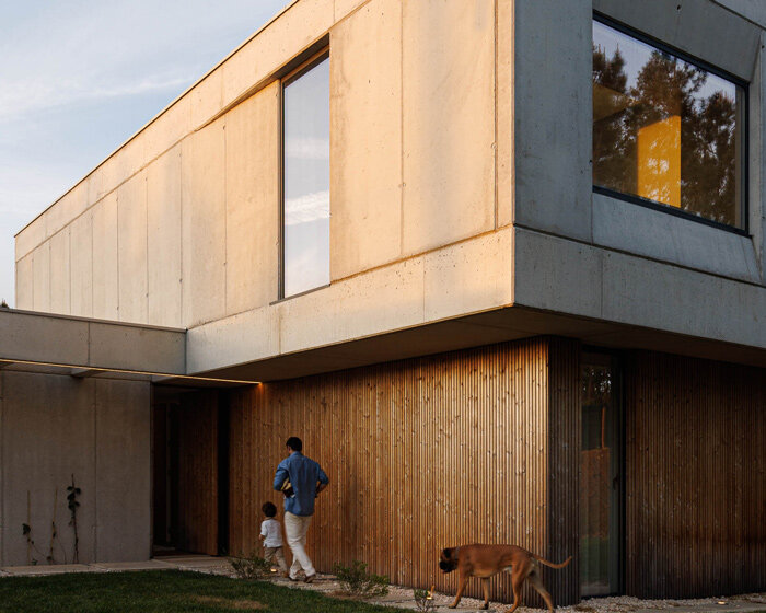 um para um builds home for mundão, portugal from concrete and warm timber