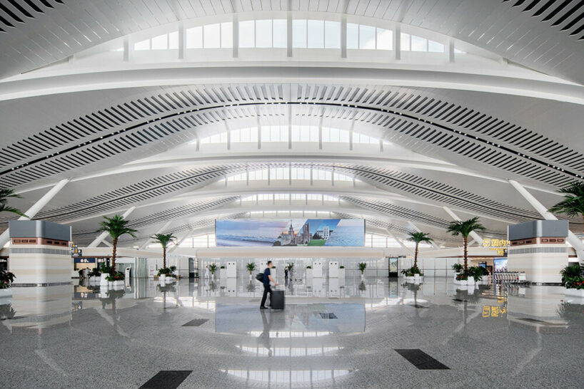 aedas' rippling terminal for yantai penglai airport echoes nearby mountains