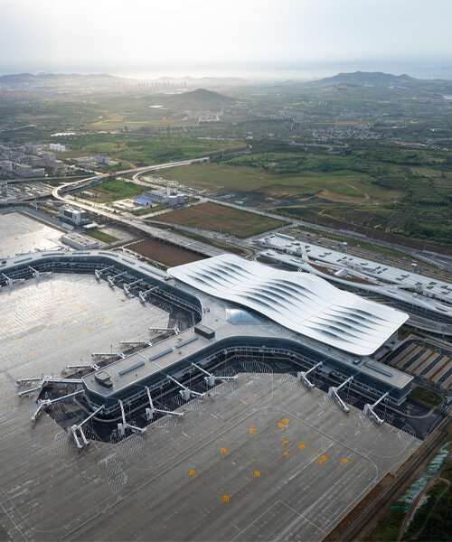 aedas' rippling terminal for yantai penglai airport echoes nearby mountainscape