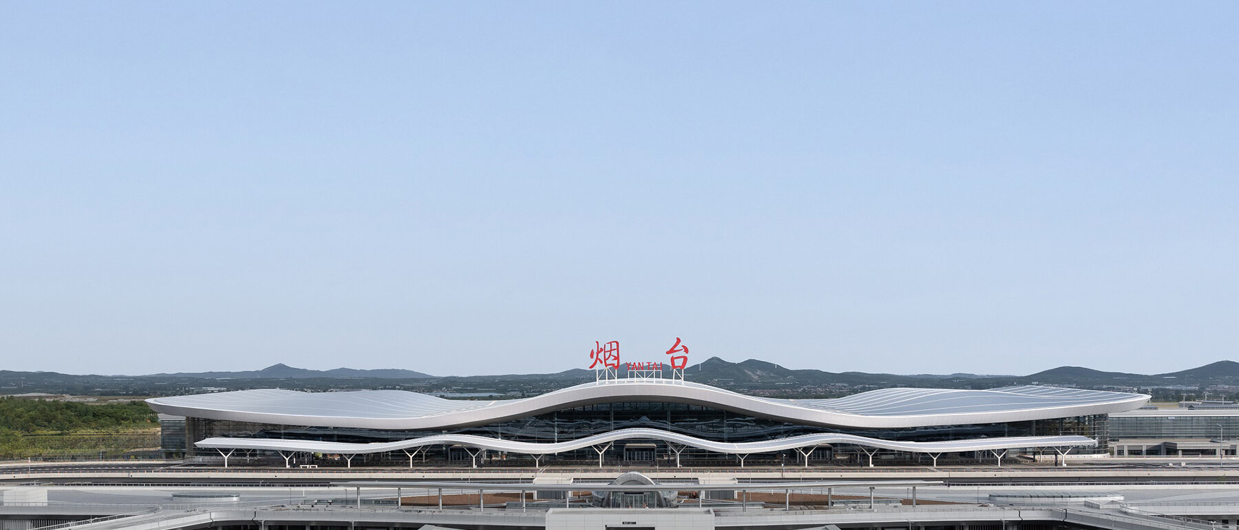 aedas' rippling terminal for yantai penglai airport echoes nearby mountains