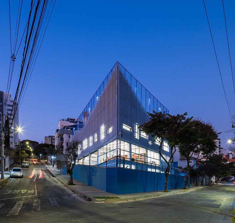 aluminum second skin facade shields alumnus school from brazilian sunlight
