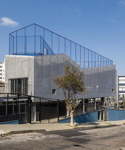 aluminum second skin facade shields alumnus school from brazilian sunlight