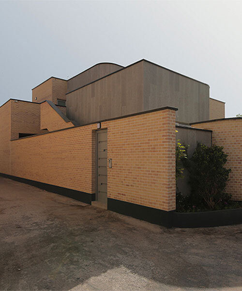 illuminating voids puncture through brick-laid annab house in iran