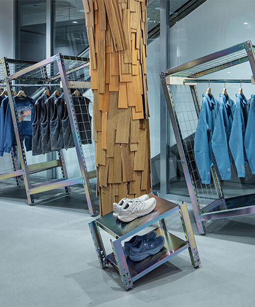 ATELIER WRITE repurposes steel racks into clothing stands for new balance's retail dispay