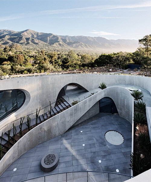 fluid concrete residence by donaldson + partners emerges from california's hillside terrain