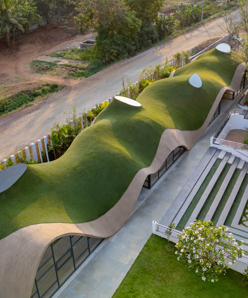 undulating green roof conceals cocoon pre-primary school in india mimicking a hillside