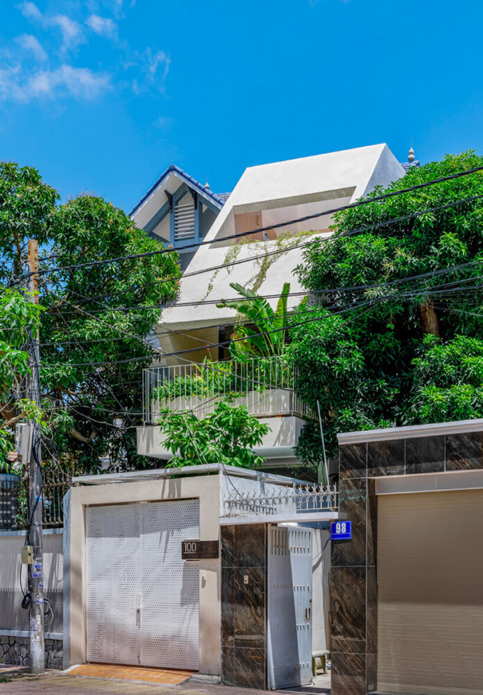 cutouts in slanted concrete roof illuminate vietnamese residence by DMA