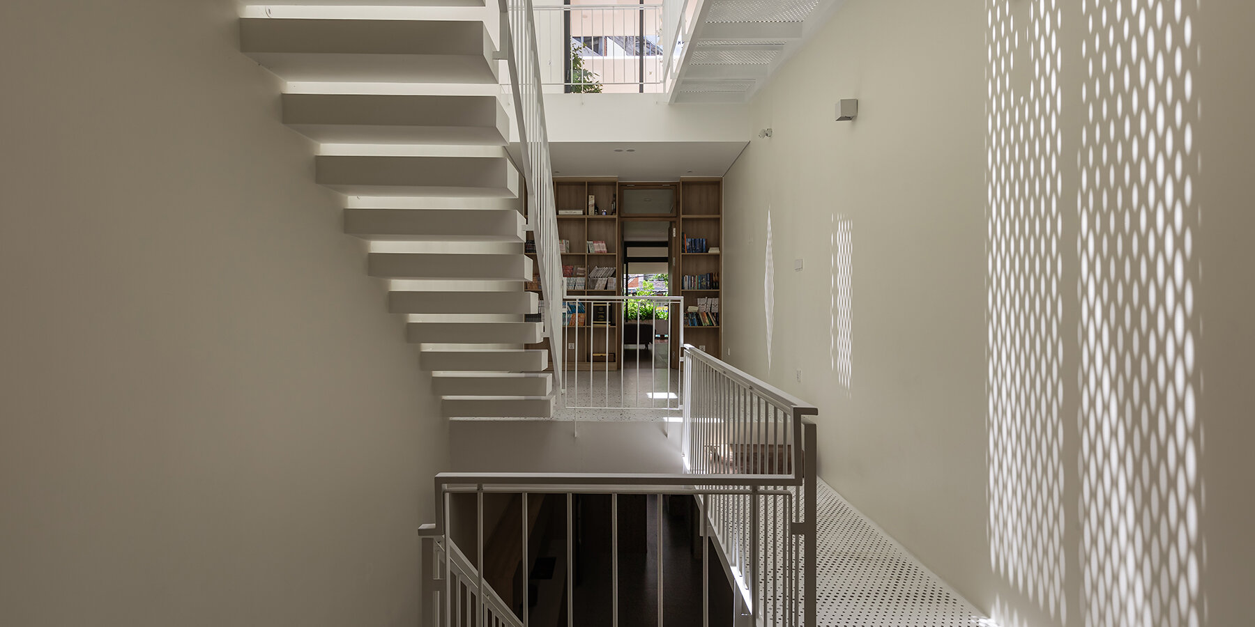 cutouts-slanted-concrete-roof-vietnamese-residence-dma-architects-10-21-2024-designboom-1800-02