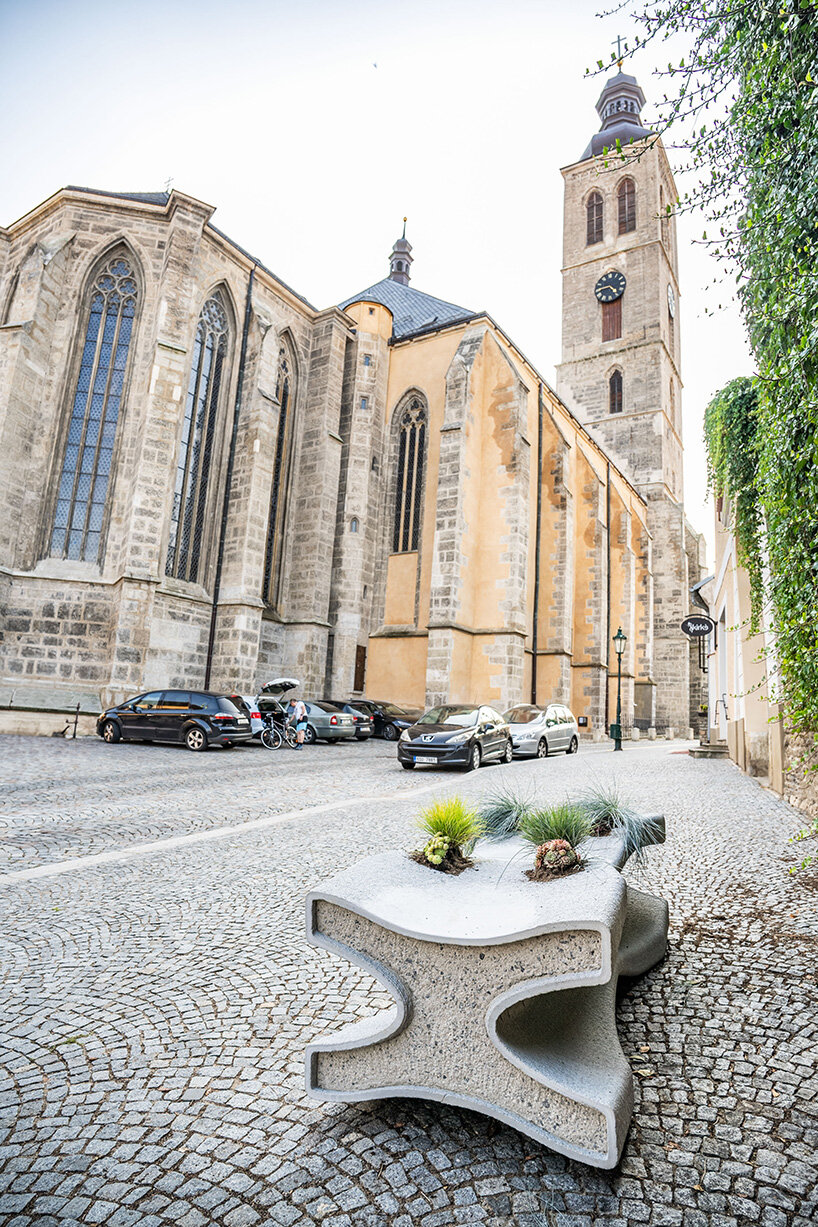 concrete bench X doubles as a planter, reflecting czech republic's gothic heritage