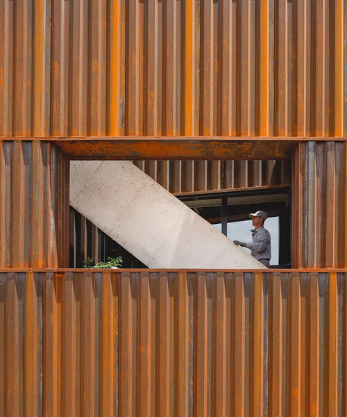 iran-based studio davood boroojeni office clads industrial architecture in raw iron sheets