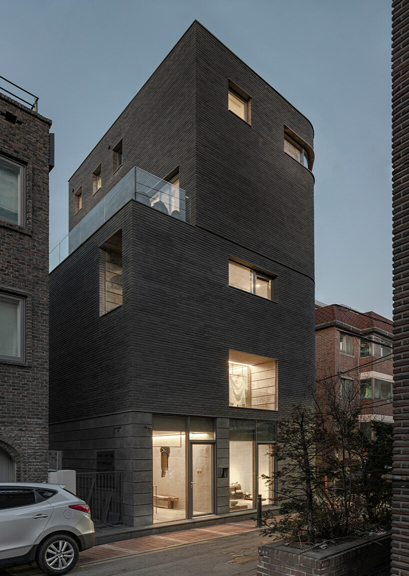gray brickwork envelops curved 'S gallery' residence near seoul forest