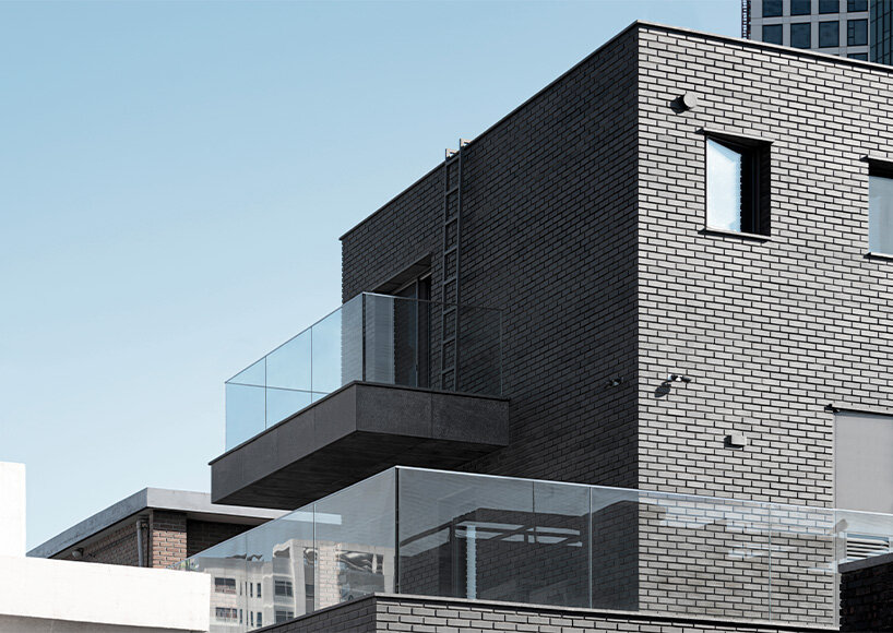 gray brickwork envelops curved 'S gallery' residence near seoul forest