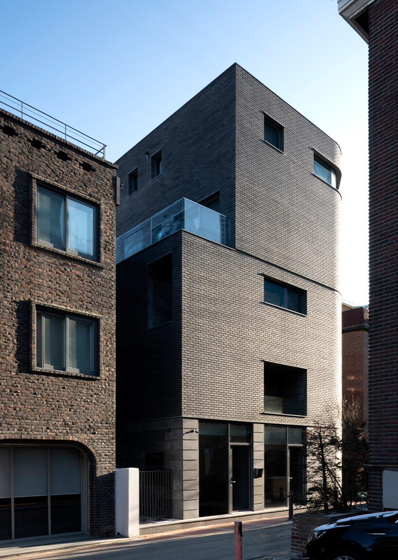 gray brickwork envelops curved 'S gallery' residence near seoul forest