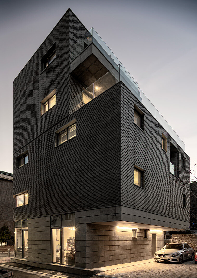 gray brickwork envelops curved 'S gallery' residence near seoul forest
