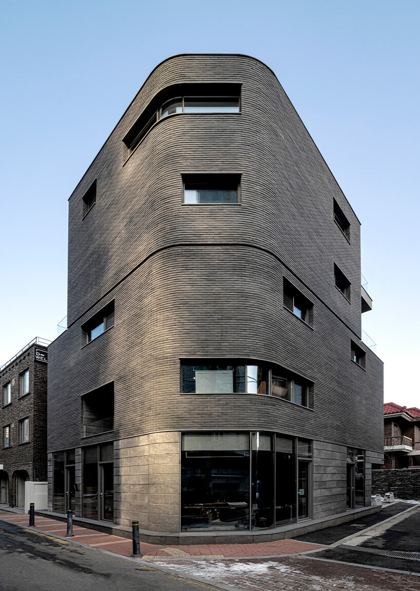 gray brickwork envelops curved 'S gallery' residence near seoul forest