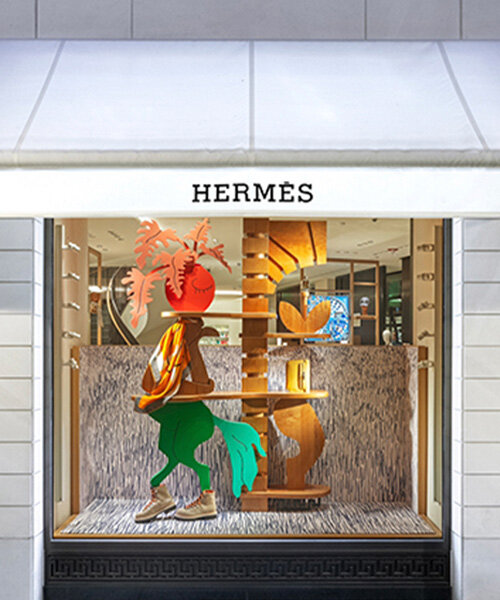 Hermès faubourg marks 100 years with surreal figures animating its windows displays