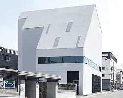 09A's white gabled house shifts perceptions of the familiar in south korean neighborhood