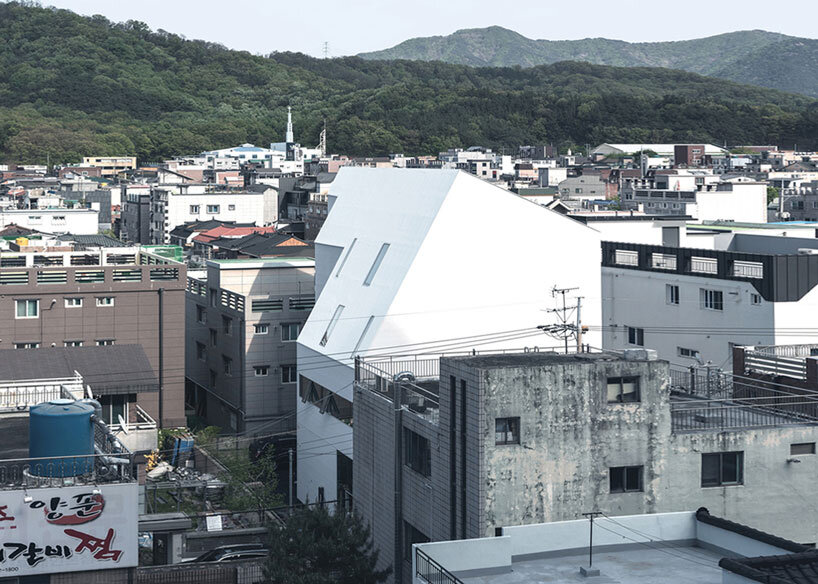 09A's white gabled house shifts perceptions of the familiar in south korean neighborhood