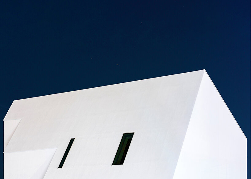 09A's white gabled house shifts perceptions of the familiar in south korean neighborhood