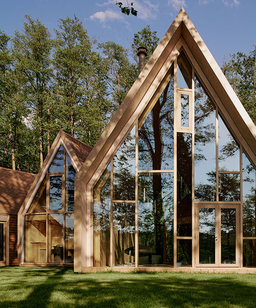 sigurd larsen staggers timber volumes to frame lake views outside berlin