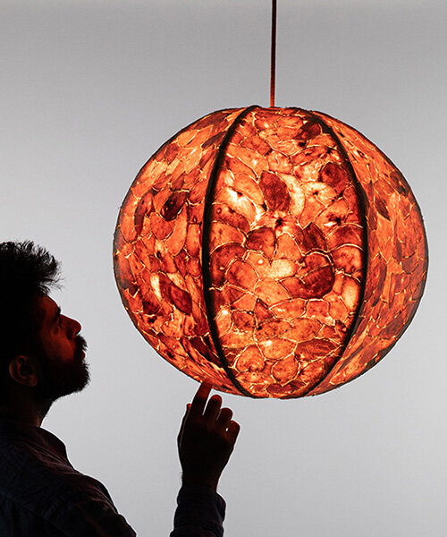 leather-like material from citrus waste wraps pendant lamp in london design festival