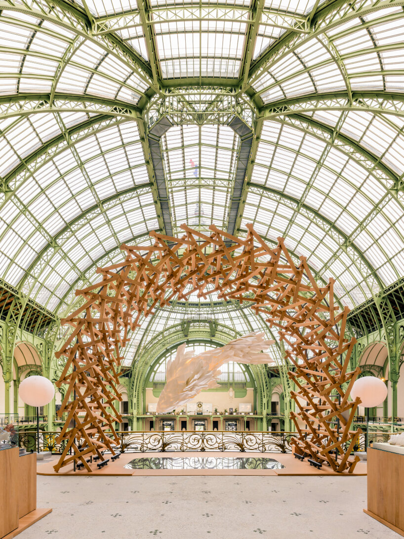 arch made of wooden slats around the fish lamp