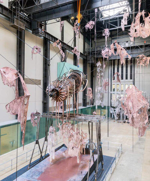 mire lee transforms tate modern's turbine hall into eerie factory of skin-like sculptures