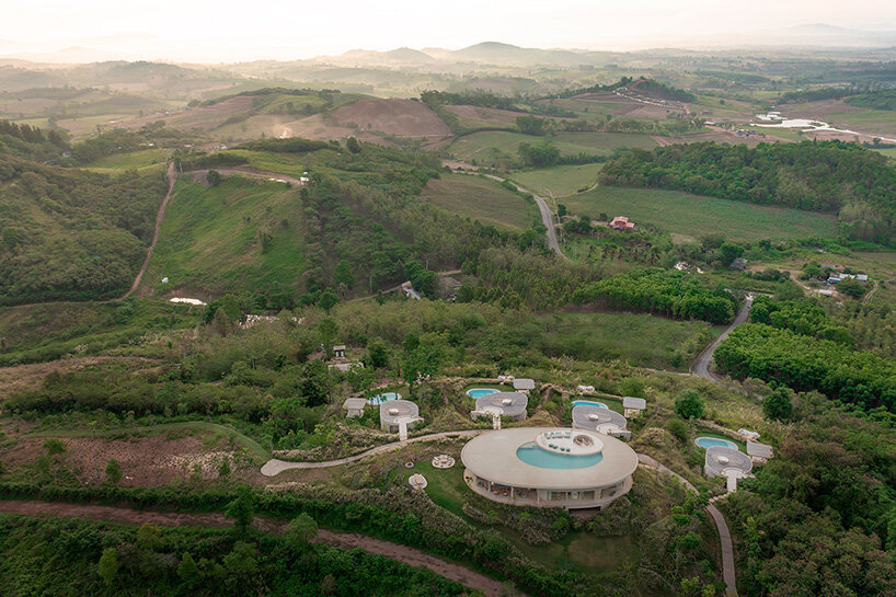 onion expands nature-inspired resort with pool villas atop thai mountains