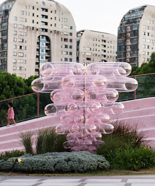 pink acrylic bubbles by naoonaoo compose undulating installation along suzhou's waterfront