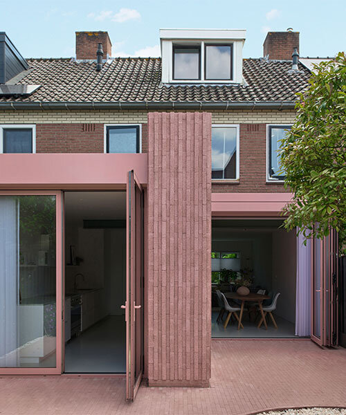 vertical pink concrete bricks wrap atlas architects' rosa home in the netherlands