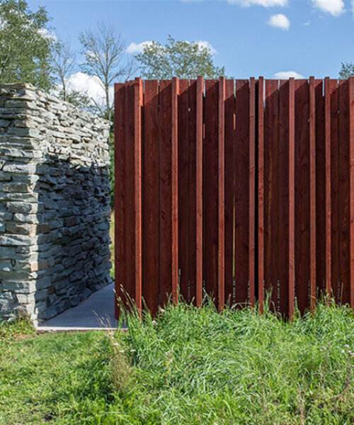 light, shadow, and texture animate j_spy's wood and brick barn in new york's white lake