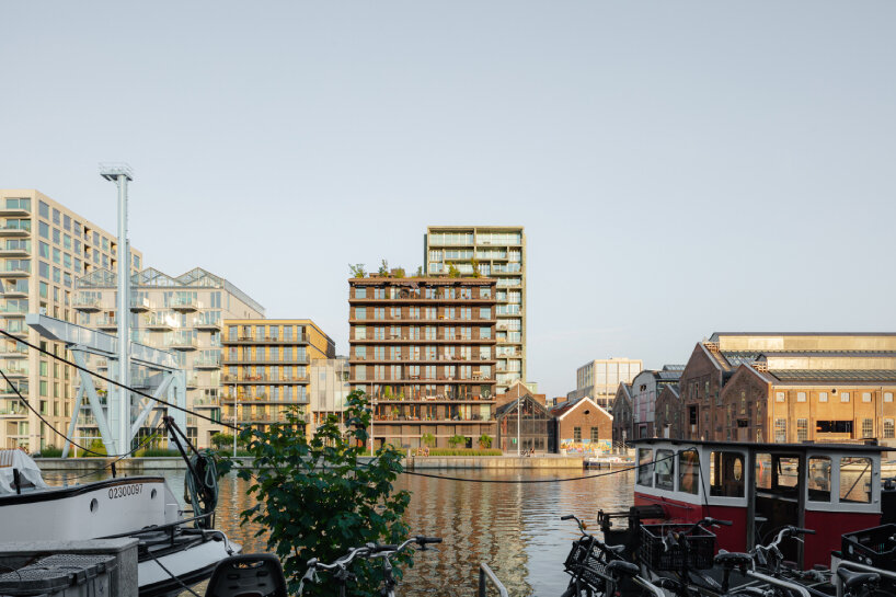 studioninedots' oostenburg island replan blends industrial heritage with urban density