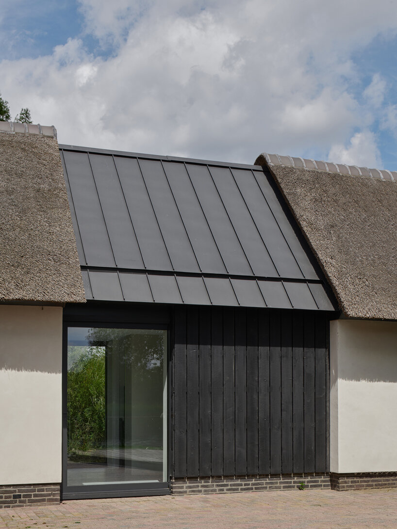 thatched-roofed boathouse addition anchors dutch villa renovation by serge schoemaker