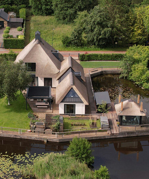 thatched-roofed boathouse addition anchors dutch villa renovation by serge schoemaker