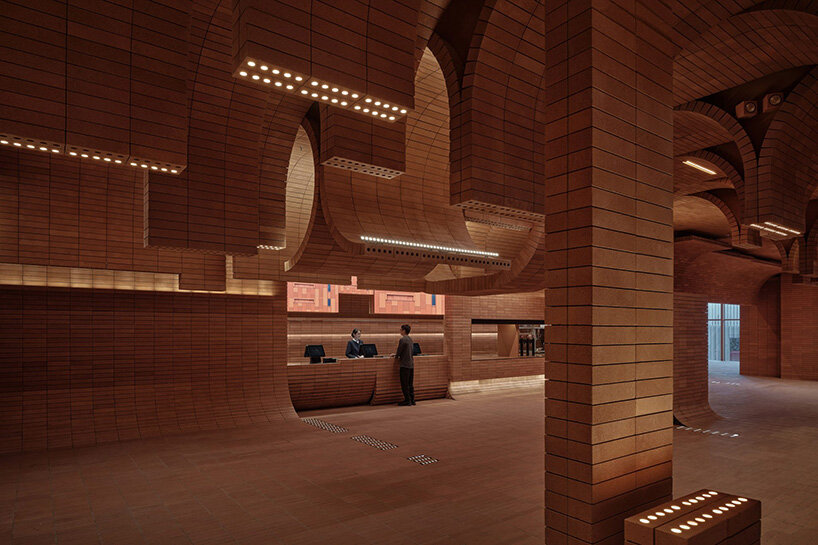 sea of undulating bricks floods chinese cinema café interiors by one plus partnership