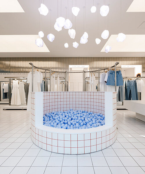 whimsical ball-filled pool takes center stage at between the walls' clothing store in kyiv