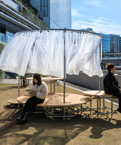 wind and light flow through organdie curtains of icai architects' street furniture in japan