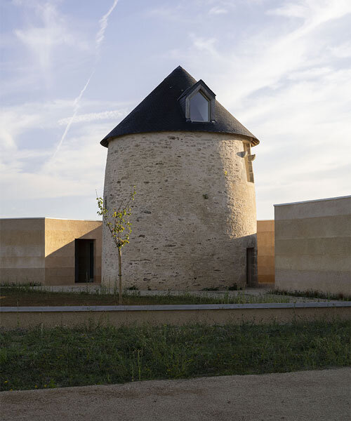 mix of local sands crafts wine storehouse's lime plaster exterior by carmen maurice in france