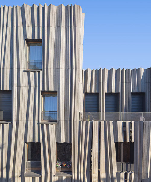 kengo kuma drapes parisian residential building 'yama-tani' in fluidly pleated timber