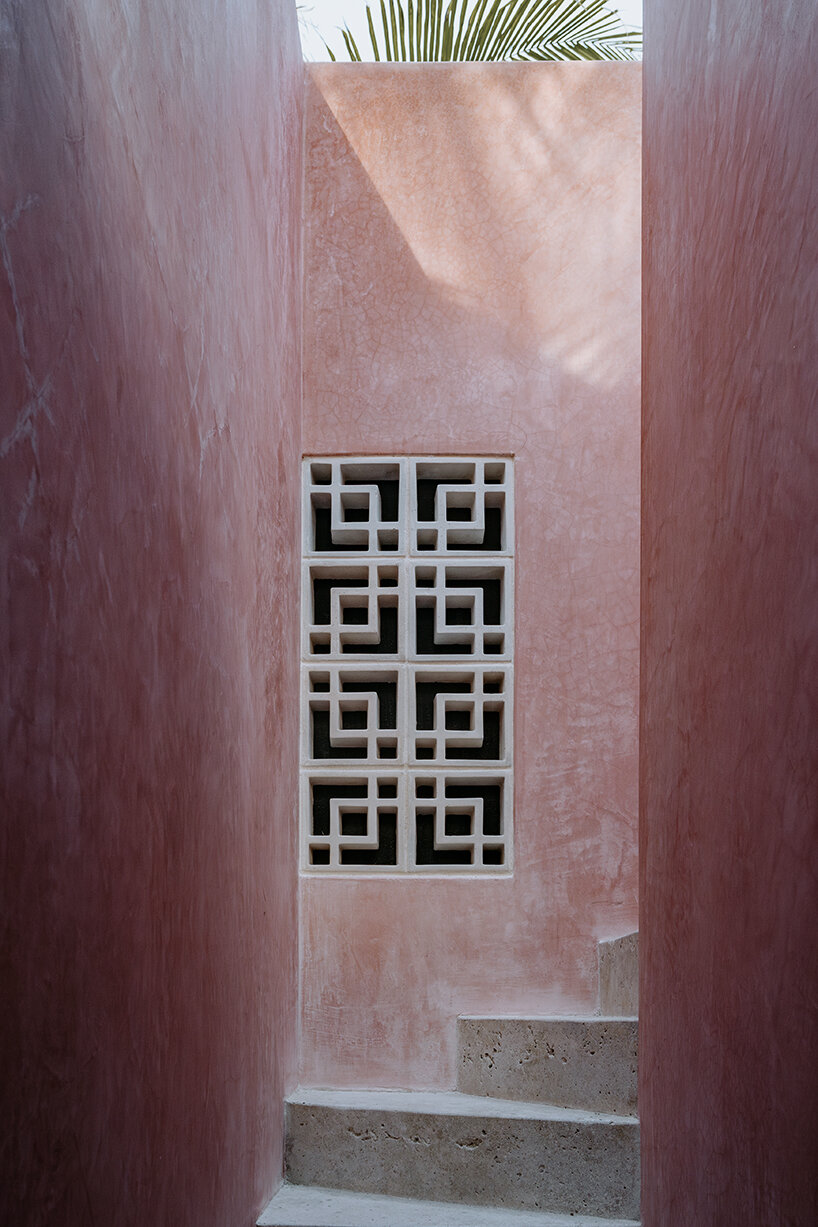 yucatan's palm trees pierce through duplex-style residential complex by proyecciones civiles