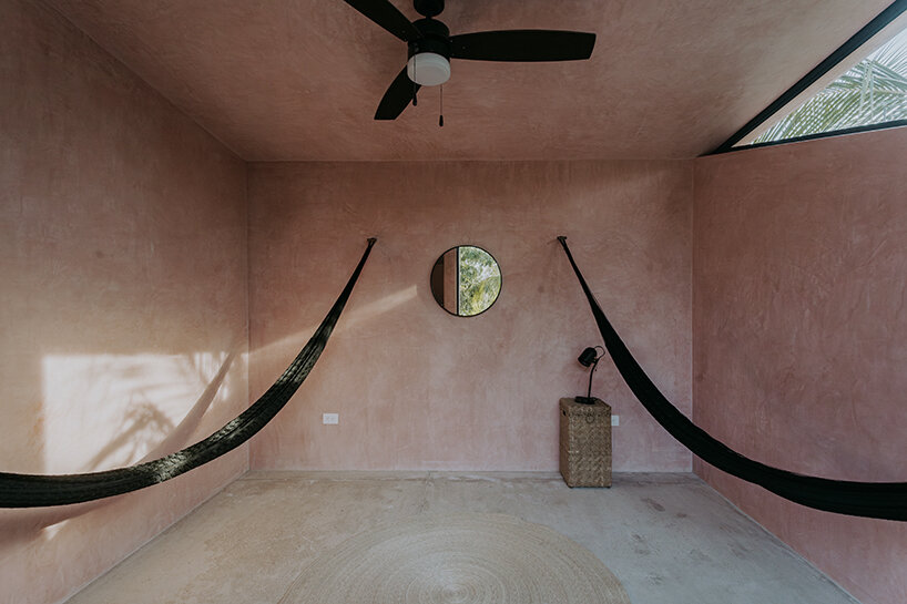 yucatan's palm trees pierce through duplex-style residential complex by proyecciones civiles