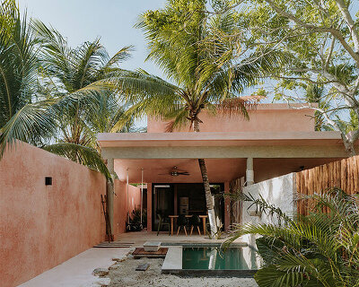 yucatan's palm trees pierce through duplex-style residential complex by proyecciones civiles