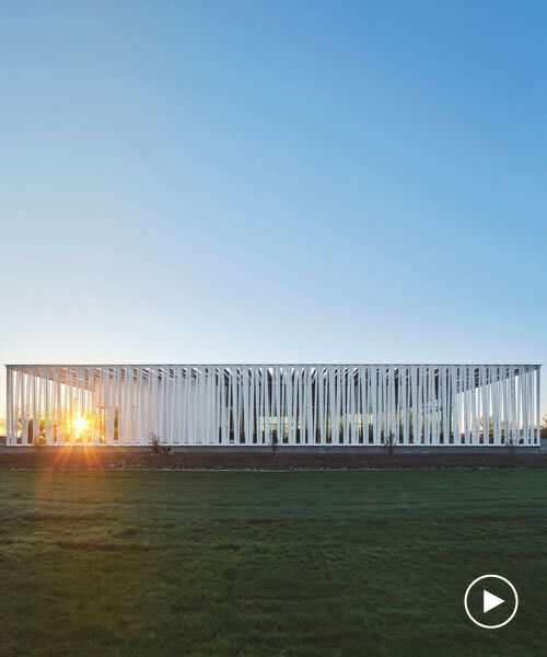 perforated metallic canopy filters light within richärd kennedy architects' asante public library