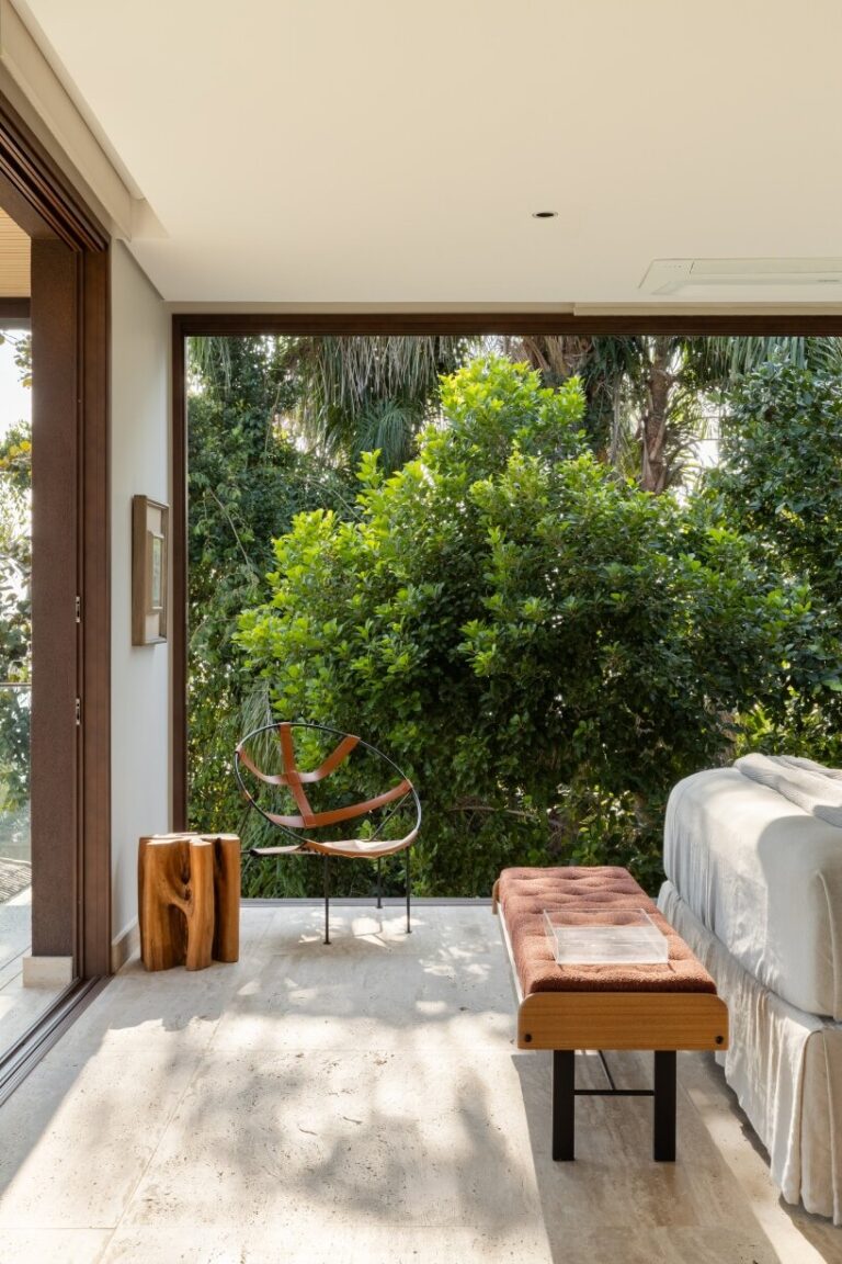 FCstudio's coastal house stacks steel, glass, & stone in são paulo