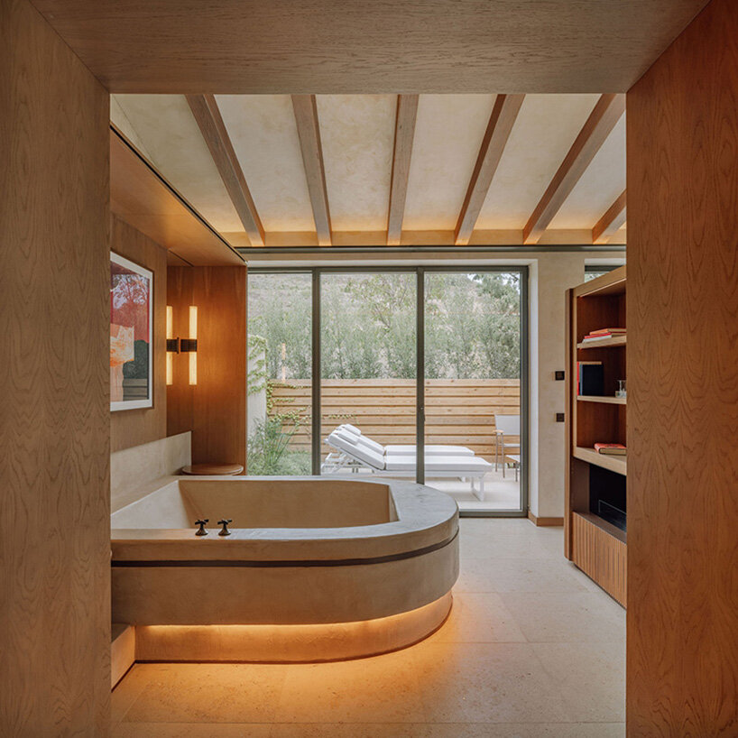 burgundy hues reflect spanish winemaking heritage in hotel by astet studio