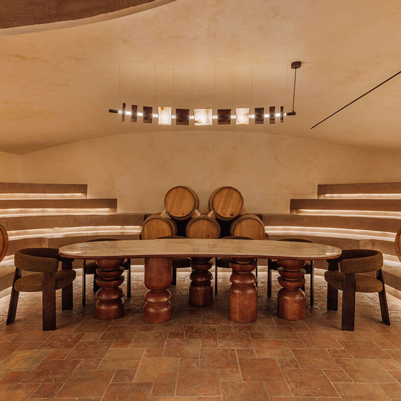 burgundy hues reflect spanish winemaking heritage in hotel by astet studio