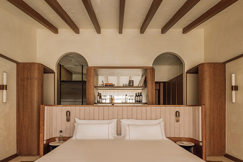 burgundy hues reflect spanish winemaking heritage in hotel by astet studio