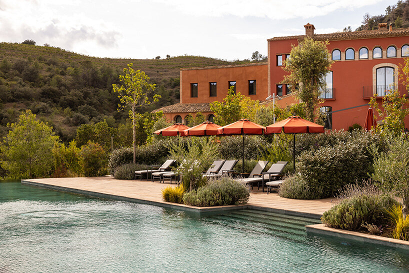 burgundy hues reflect spanish winemaking heritage in hotel by astet studio