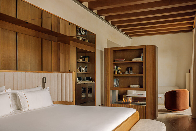 burgundy hues reflect spanish winemaking heritage in hotel by astet studio