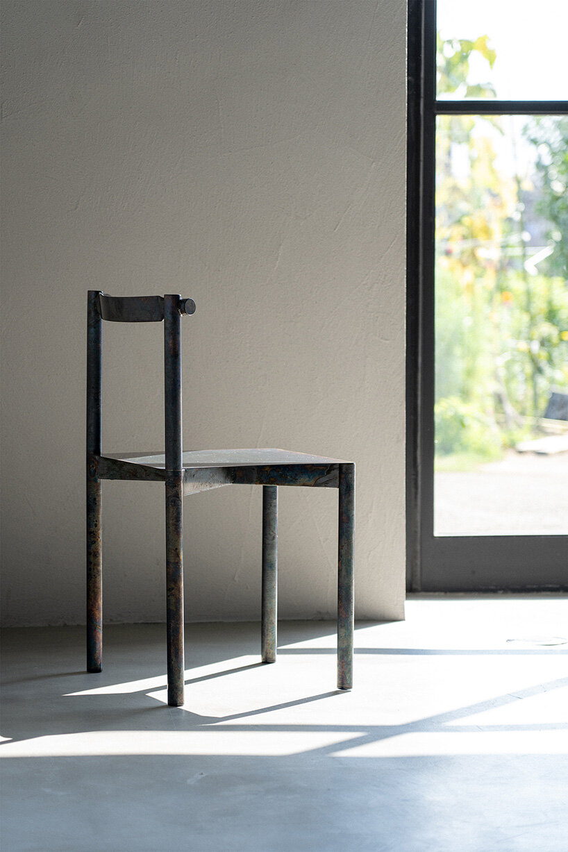 flattened piping becomes linear backrest in masaya kawamoto’s oxidized steel chair